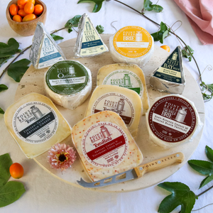 Bob's Big Cheese packaged on a round board