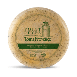 Point Reyes Farmstead Cheese Co. Toma Provence cheese wheel on a white background