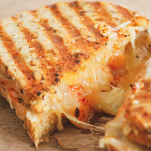 A grilled cheese sandwich made with TomaRashi and kimchi