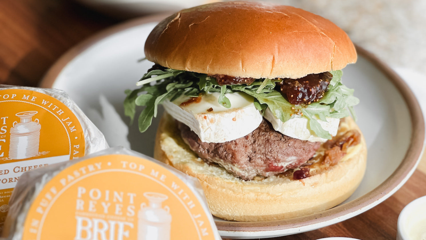 Burger with Brie and fig jam on a plate
