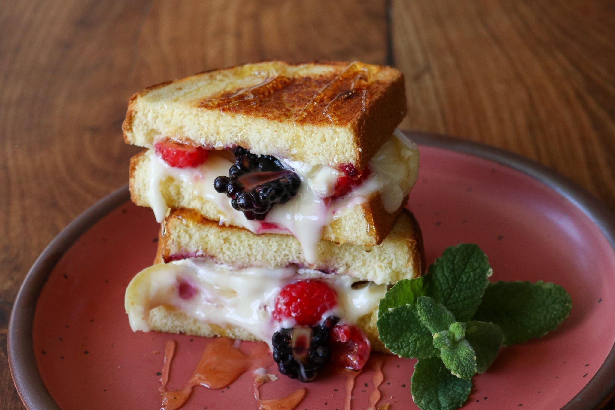 Grilled chees with Brie and Berries stacked on a plate