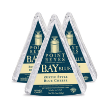 Three packages of Point Reyes Bay Blue Rustic Style Blue Cheese on a white background