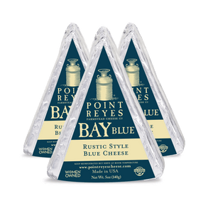Three packages of Point Reyes Bay Blue Rustic Style Blue Cheese on a white background