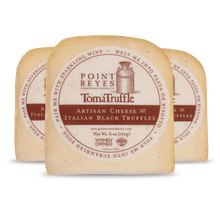 Point Reyes Toma Truffle cheese with label on a white background