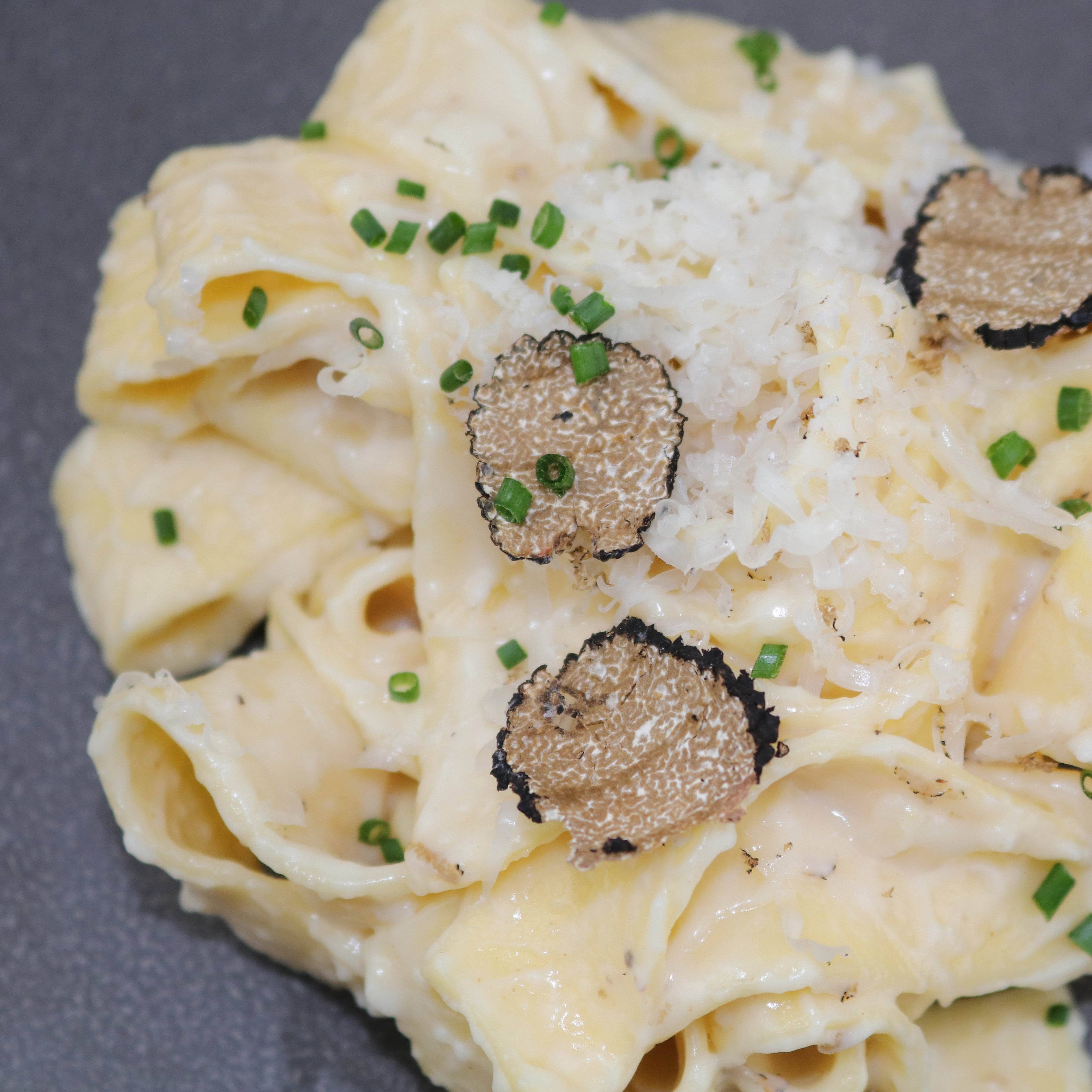 Cheesy TomaTruffle pasta with shaved truffles 